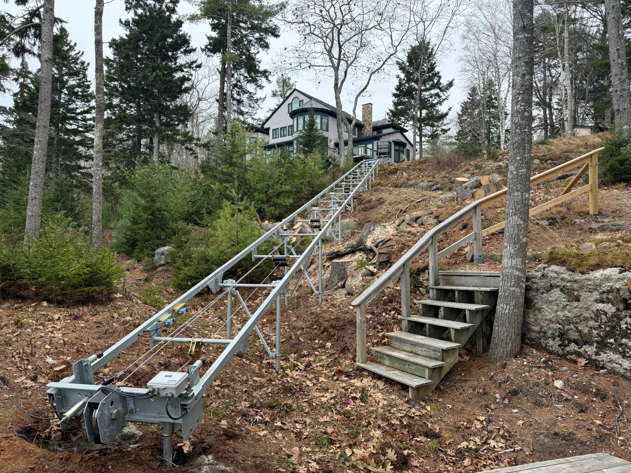 House on hill with metal track structure