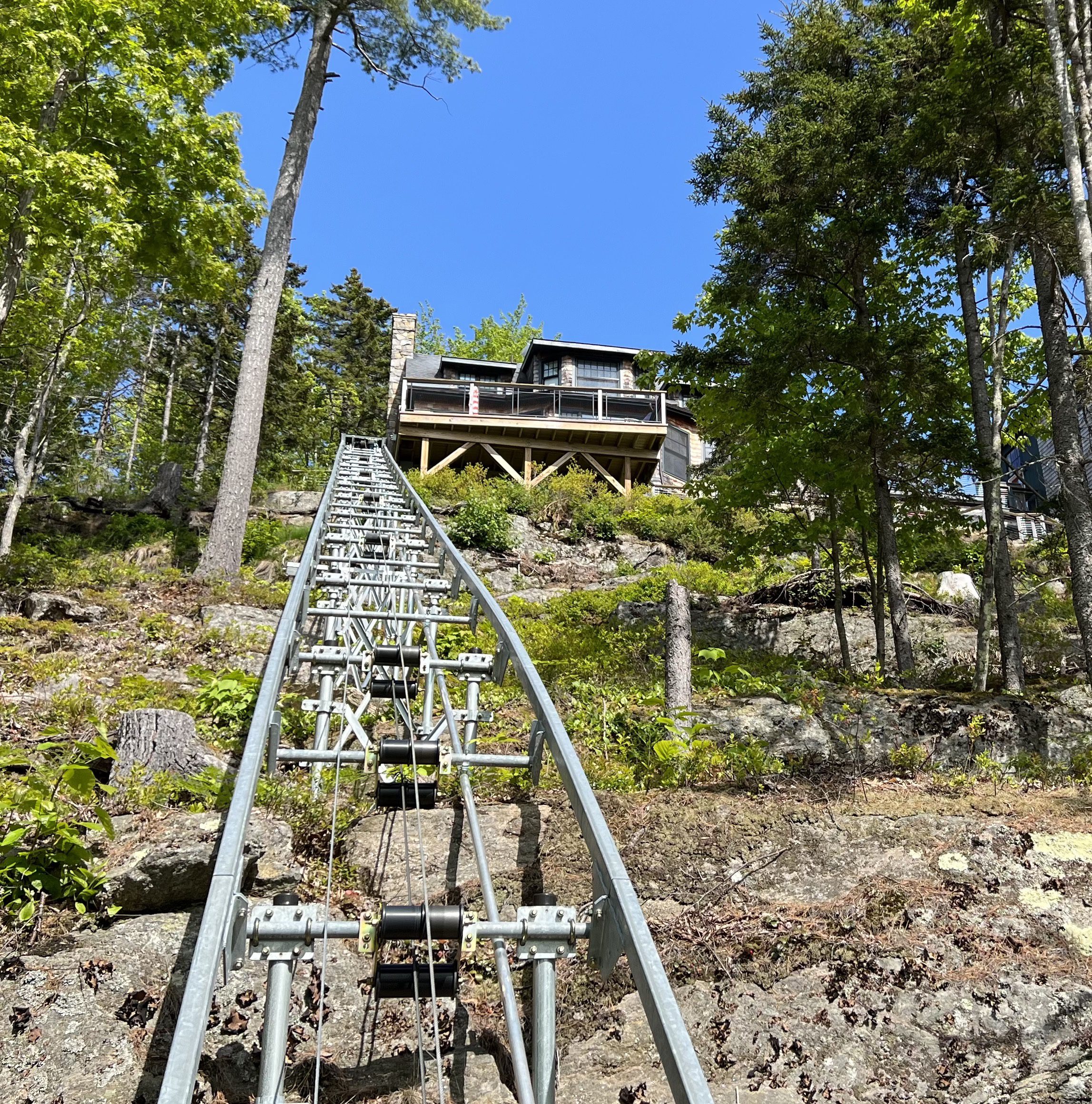 Funicular track ascending to house on hillside